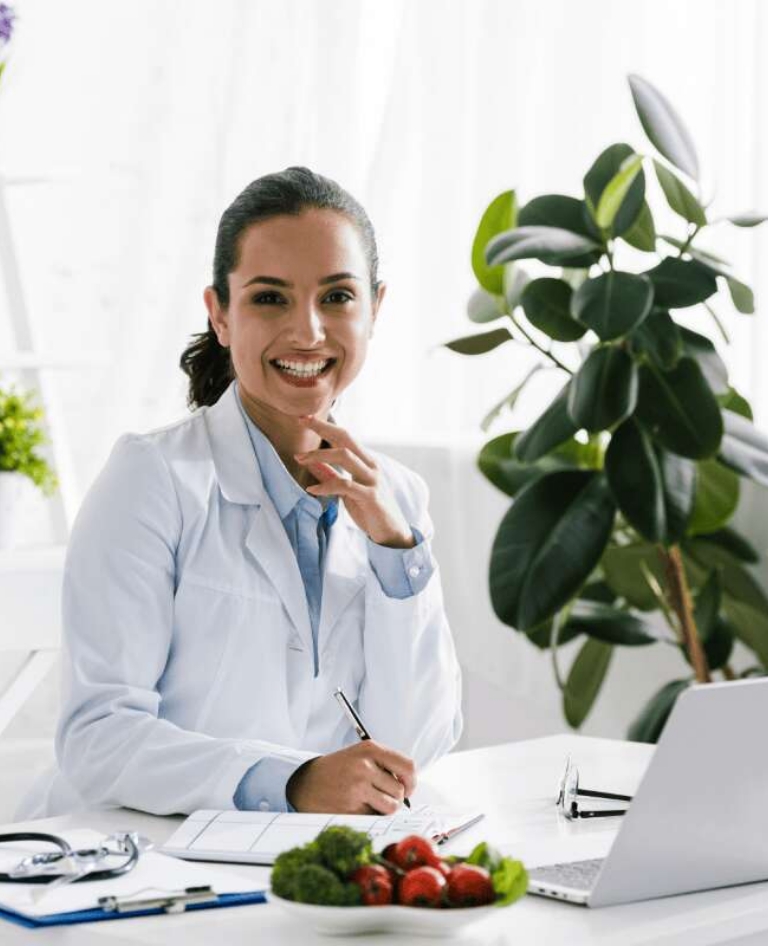 smiling woman at desk